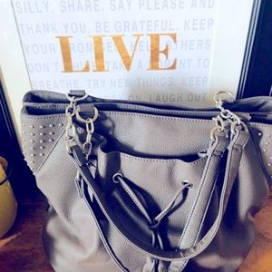Gray leather handbag with silver accents